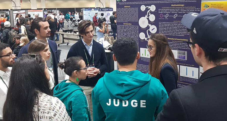 The iGEM team presents their work to judges at the competition in Boston.