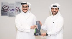 The CEO of Qatar Development Bank, Abdulaziz Nasser Al-Khalifa, presents Ali Al-Maadid with the Mashrouie award at the 2020 Al Fikra business competition. 