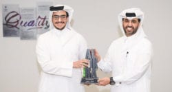 The CEO of Qatar Development Bank, Abdulaziz Nasser Al-Khalifa, presents Ali Al-Maadid with the Mashrouie award at the 2020 Al Fikra business competition.