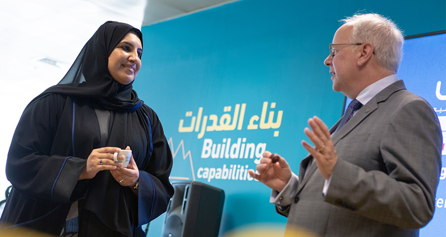 Dean Michael Trick and Mada Center CEO Maha Al-Mansouri signed a memorandum of understanding in 2019.