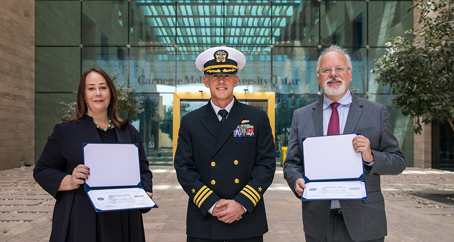 Daniel Phelps presents Selma Limam Mansar and Michael Trick with the ESGR Patriot Award.