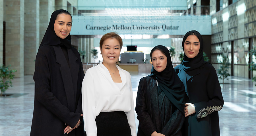 Nui Vatanasakdakul and three of the students in the e-business course that explored female entrepreneurship in Qatar.
