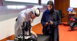 Lujain Al Mansoori and Mohammad Annan demonstrating the extruder that has been adapted for the cell culture.