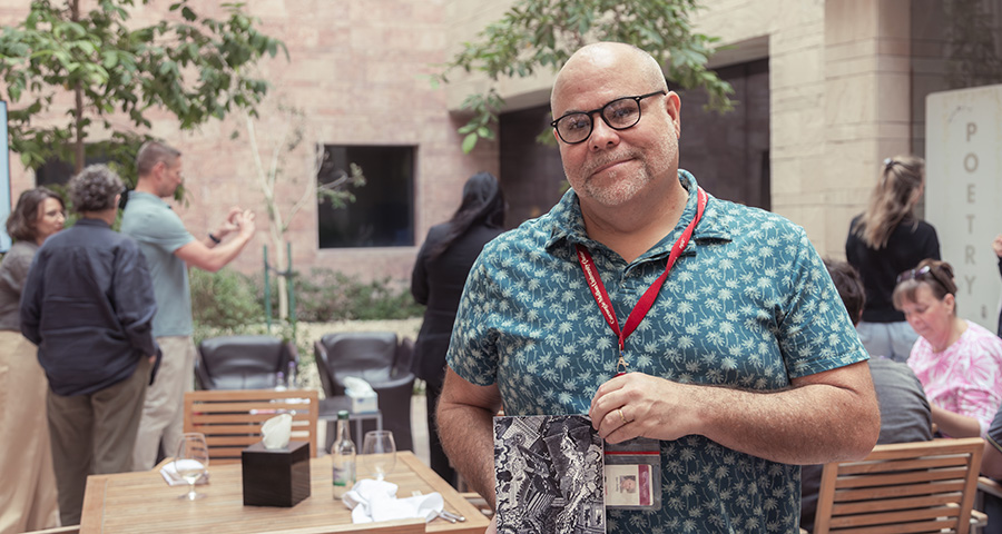 Faculty Ben Reilly with his book