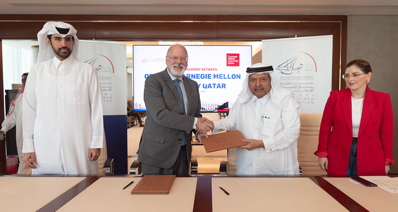 QBA chairman HE Sheikh Faisal bin Qassim al-Thani and CMU-Q dean Michael Trick sign MOU